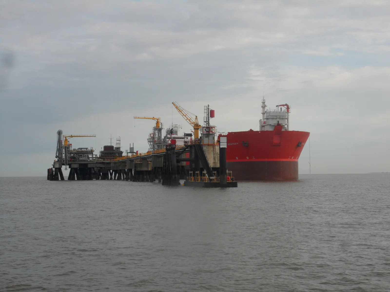 A tanker moored alongside an offshore structure to take on crude, the job an FSO does